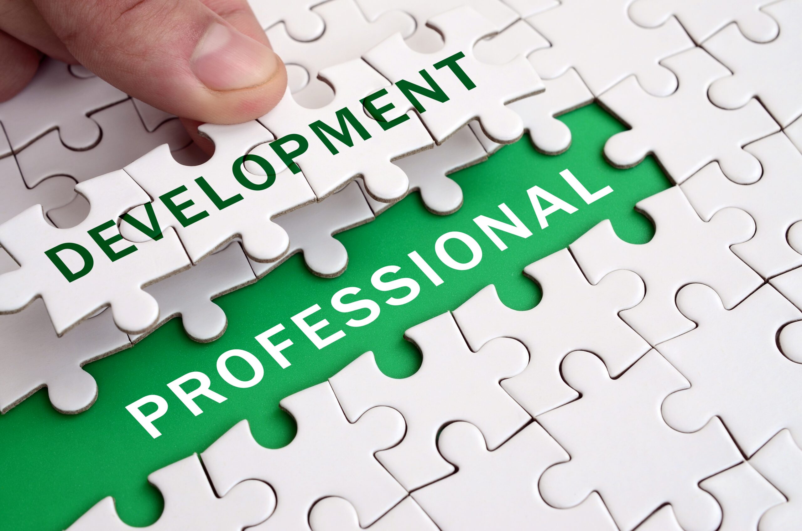 Puzzle pieces coming together to represent professional development goals and long-term career growth.